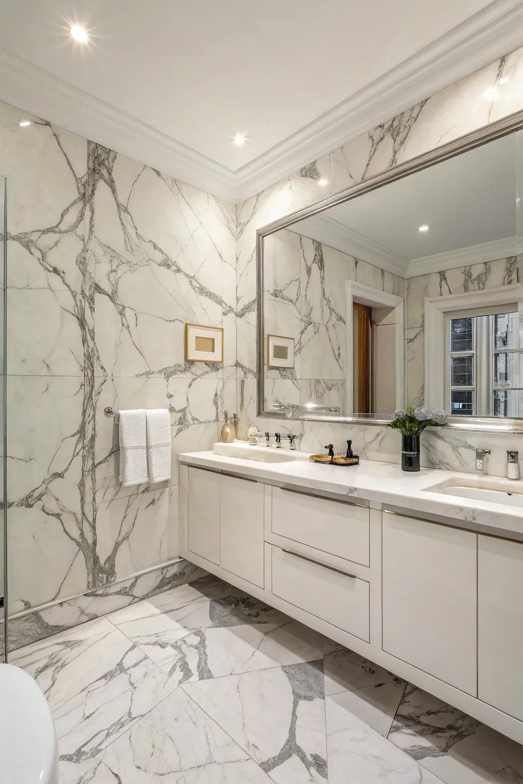 A fluid and elegant bathroom with full Luminous Argento marble walls.