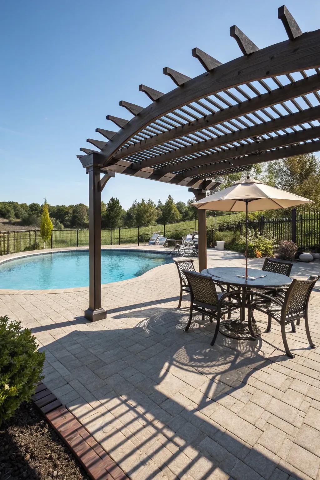 A pergola presents a shaded retreat on the pool deck.