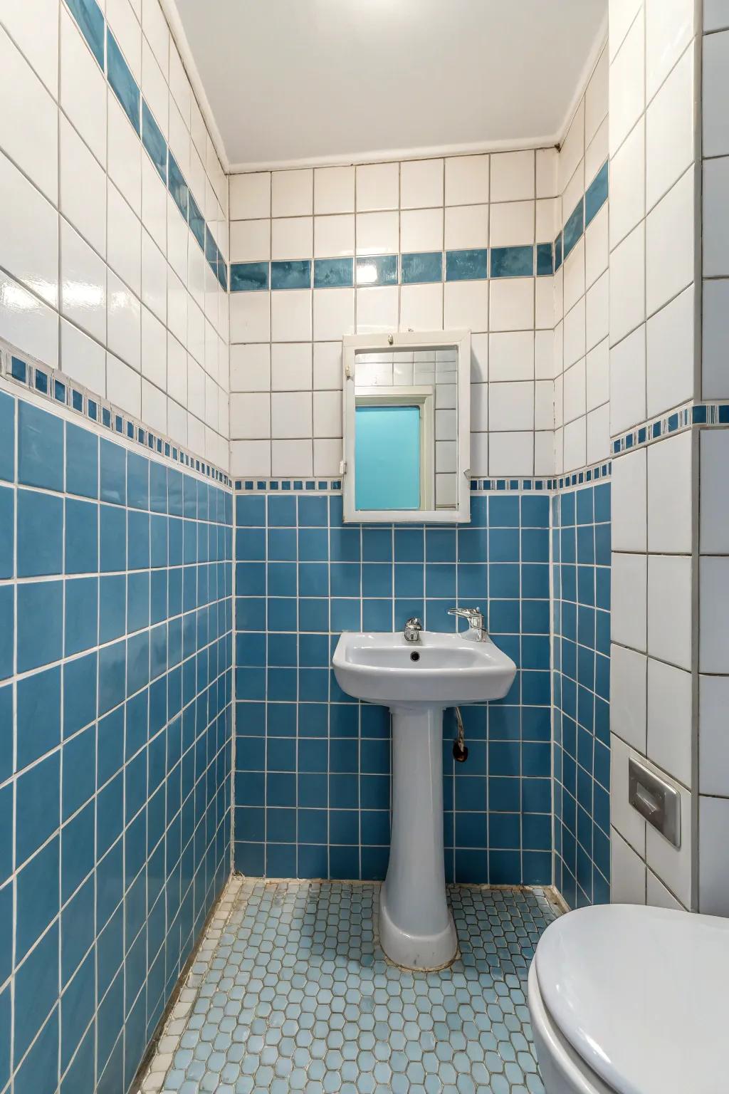 Blue tiles outlined using white grout present a tidy and sophisticated appearance.