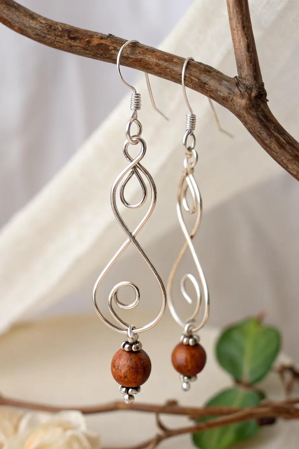 Discover the elegance of simplicity with modeled wire art earrings, where creation meets ingenuity.