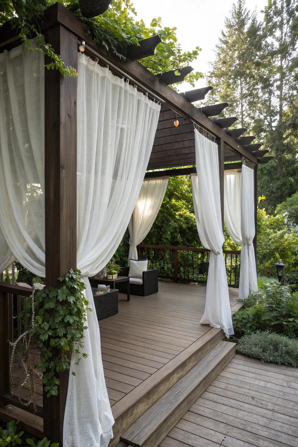 A pergola with curtains for privacy and coziness.