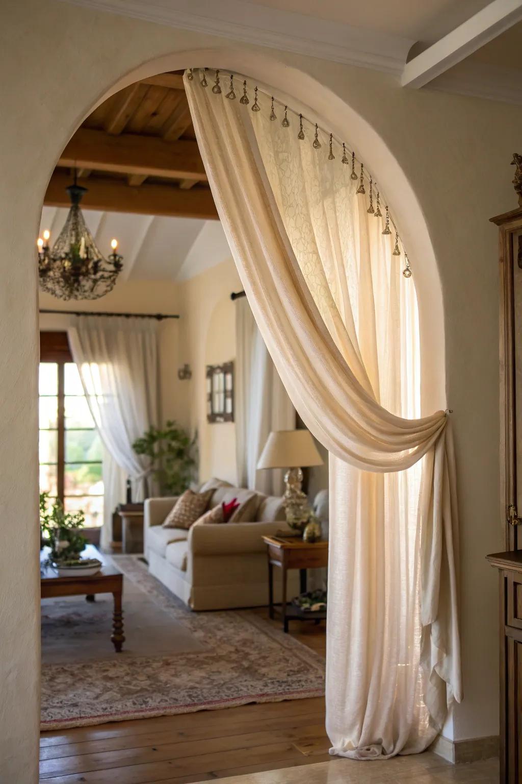 Drapes elegantly define and enhance arched openings.