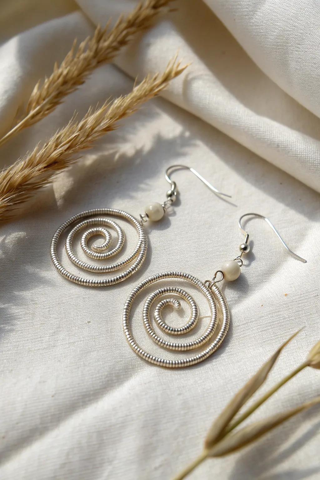Discover the art of simplicity with these elegant spiral wire earrings, where skill meets minimalist beauty.