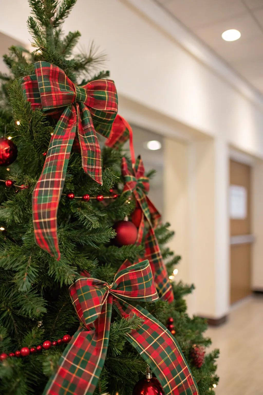 A traditional tartan-themed Christmas tree with red and green accents.