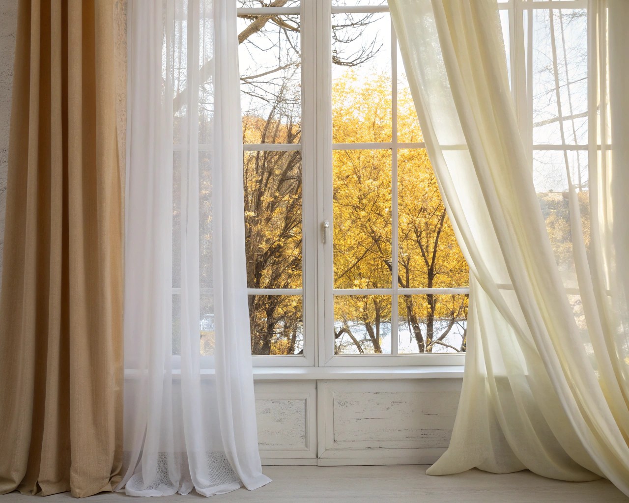 Window treatments adapted for energy efficiency and aesthetic changes through seasons.
